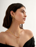 Katie Loxton gold coated ribbon bow necklace, UK version