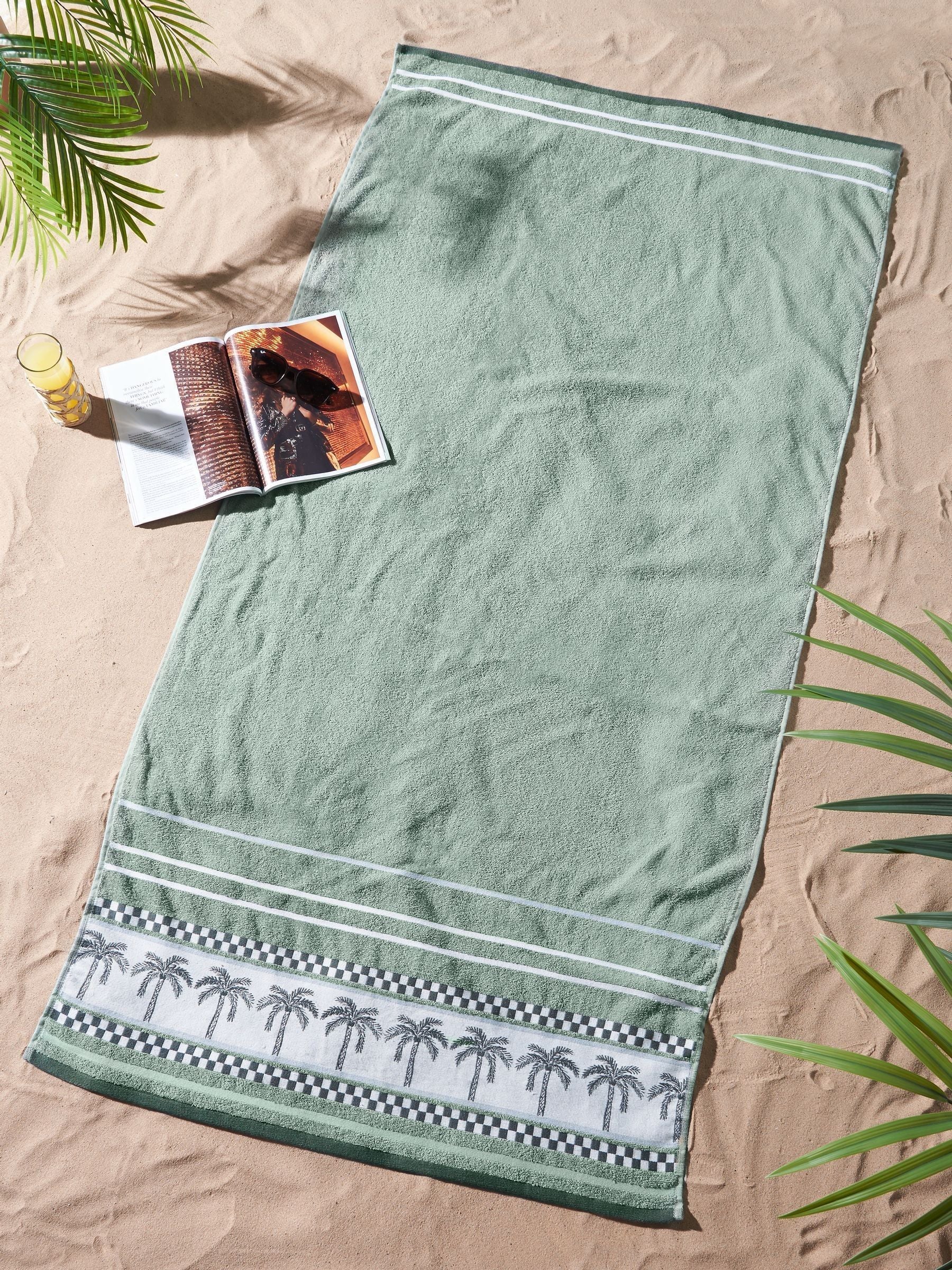 Catherine Lansfield extra large green palm beach towel, imported from the UK