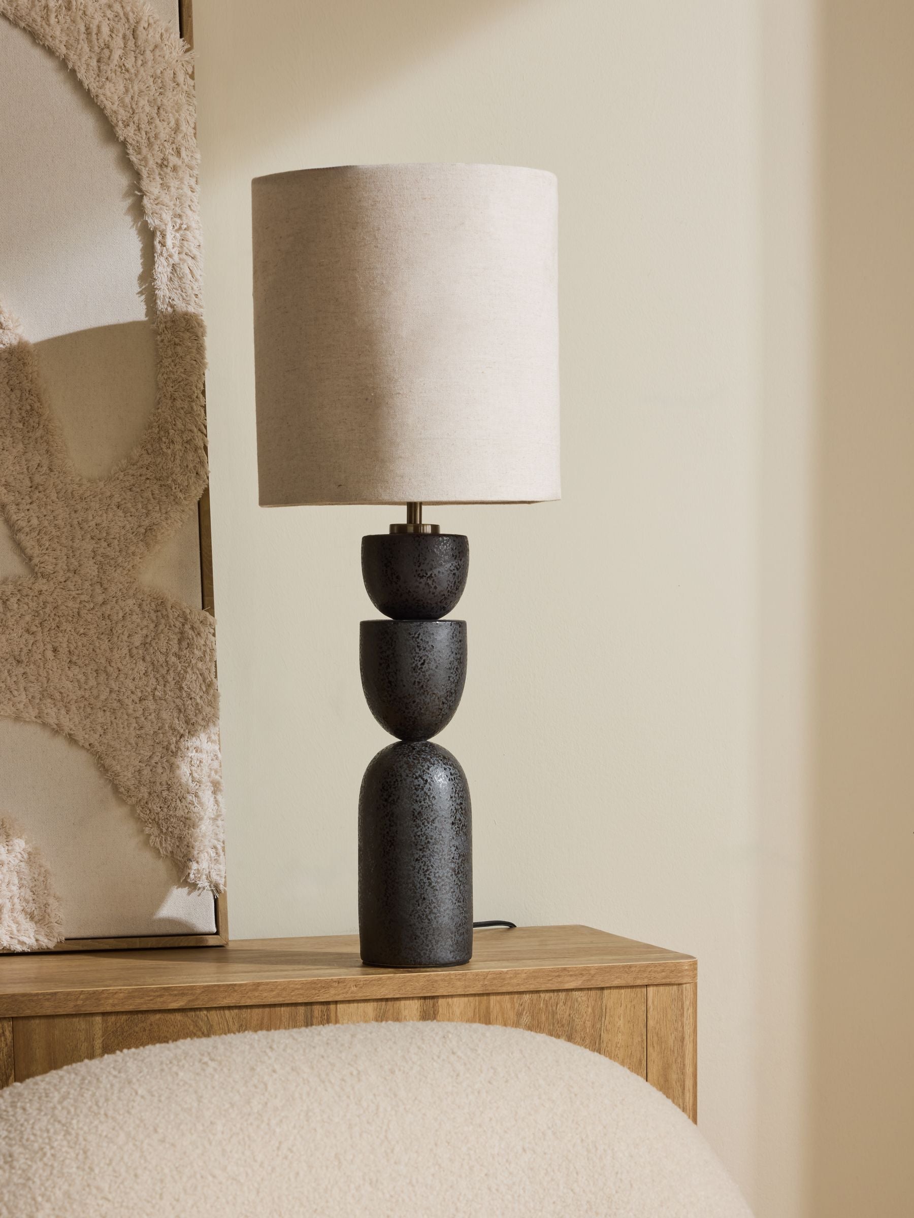 Black Kara table lamp with ceramic base and textile shade, UK version