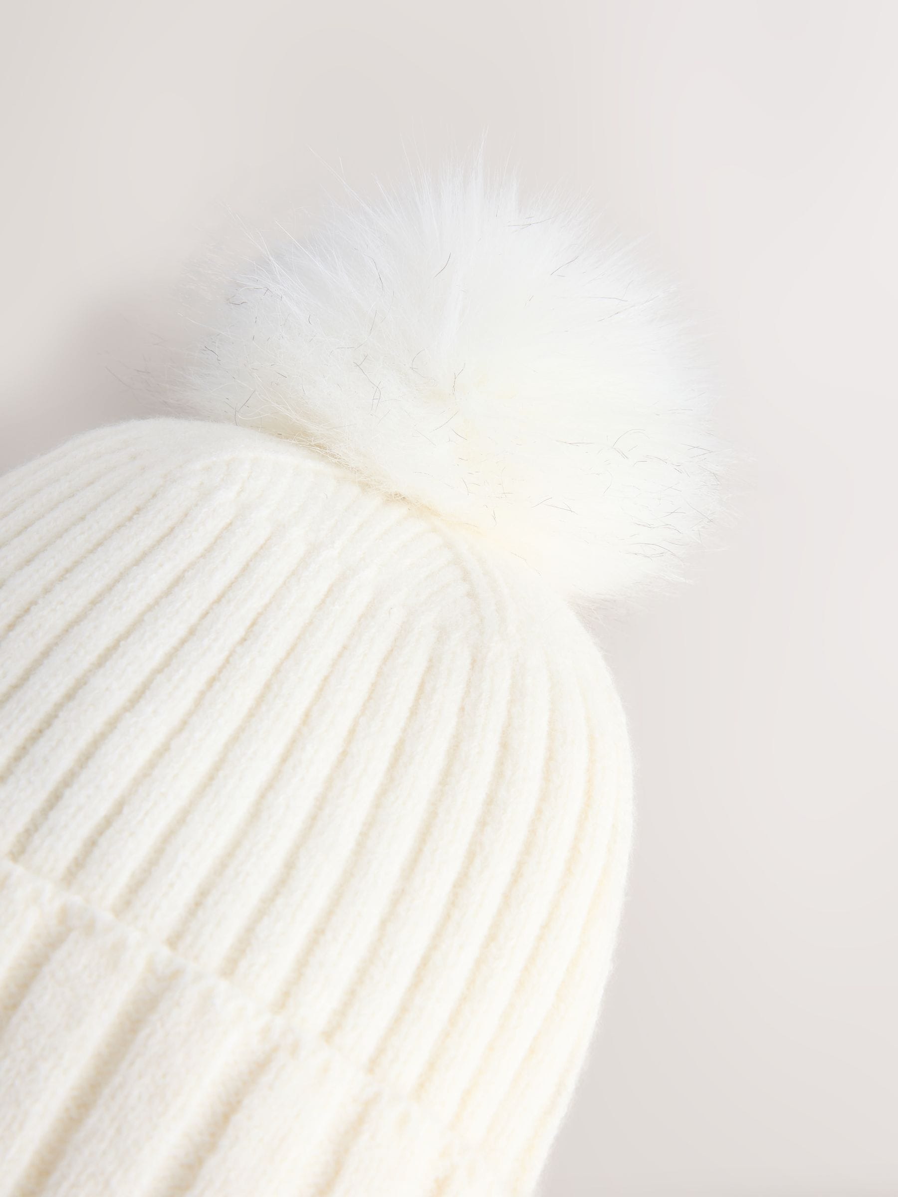 Ecru rib knit beanie with pom pom, imported from the UK