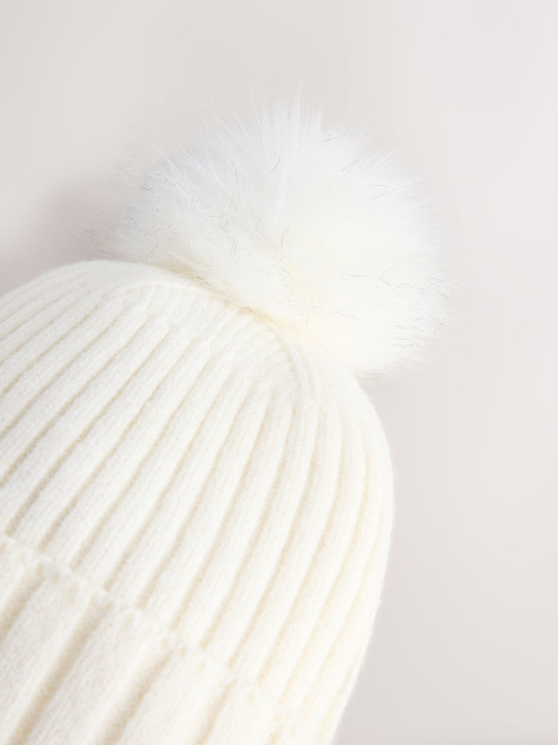 Ecru rib knit beanie with pom pom, imported from the UK