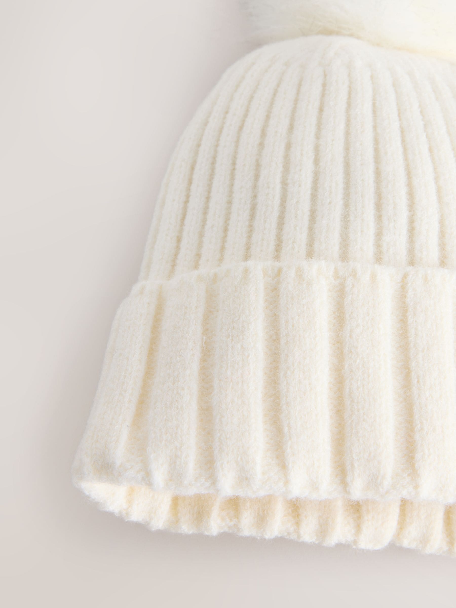 Ecru rib knit beanie with pom pom, imported from the UK