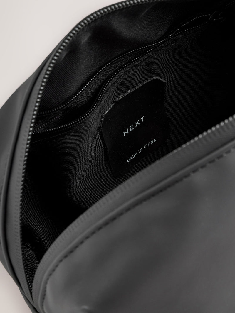 Black rubberised washbag with water-resistant finish, UK version