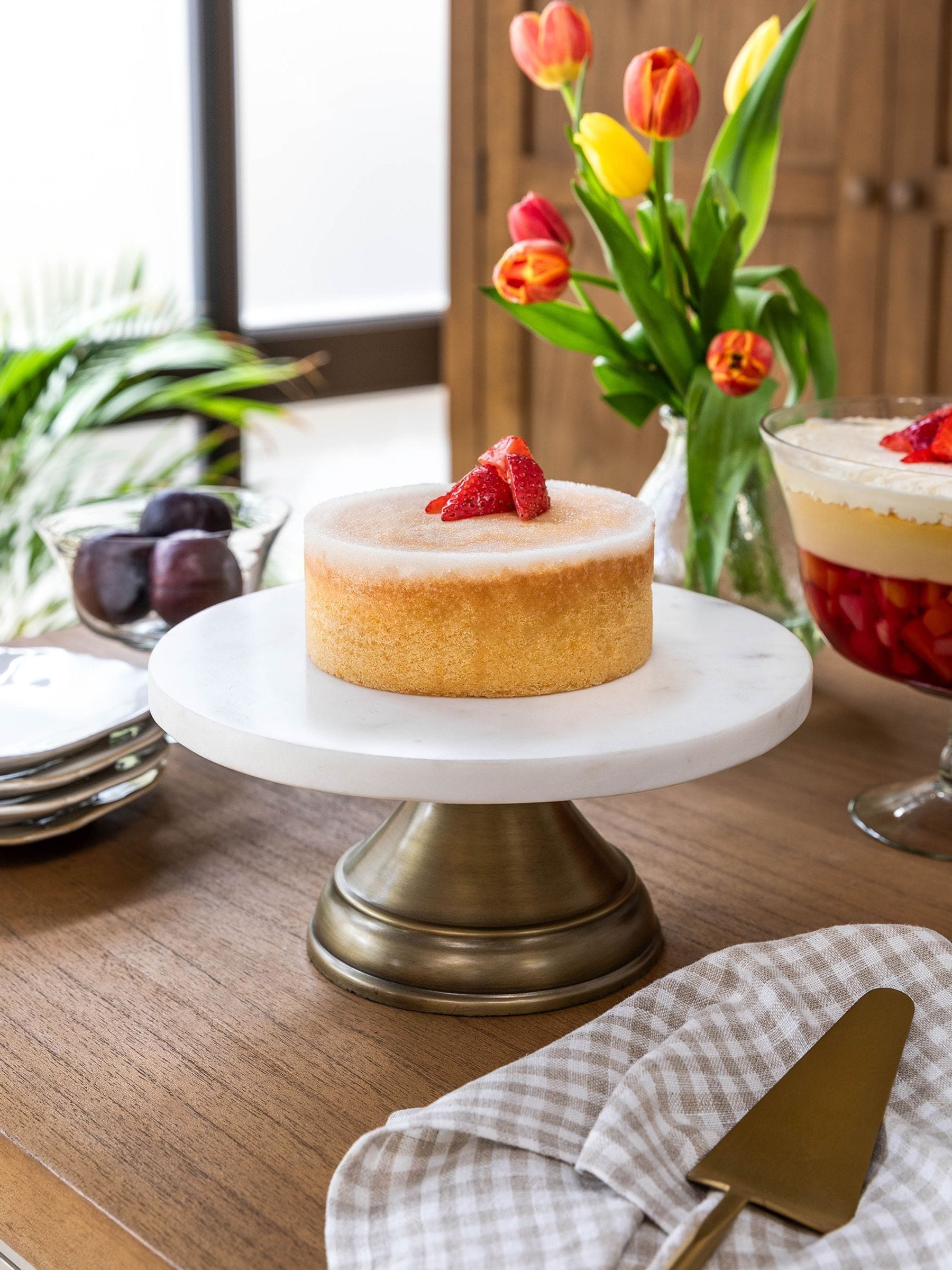 Garden Trading white marble cake stand with antique brass base, imported from the UK