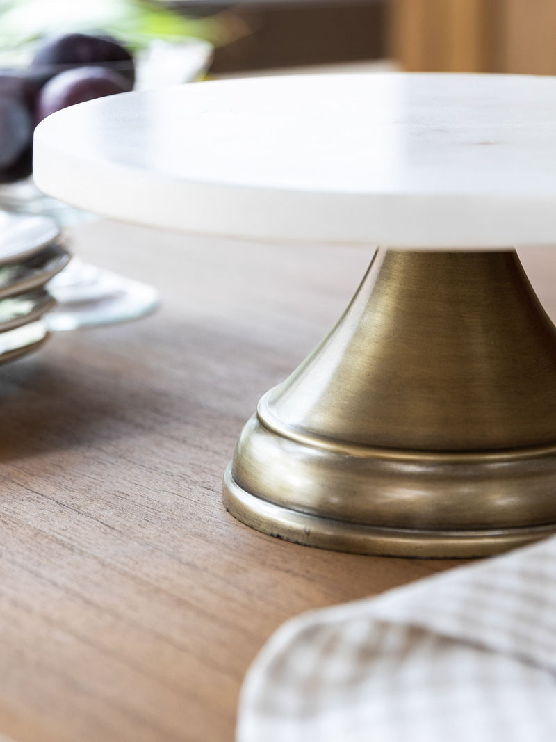 Garden Trading white marble cake stand with antique brass base, imported from the UK