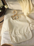 Avery Row sleeved bib in Daisy Meadow pattern (British brand)