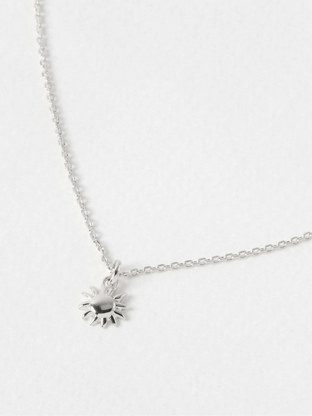 Oliver Bonas sterling silver sun charm pendant necklace, UK version