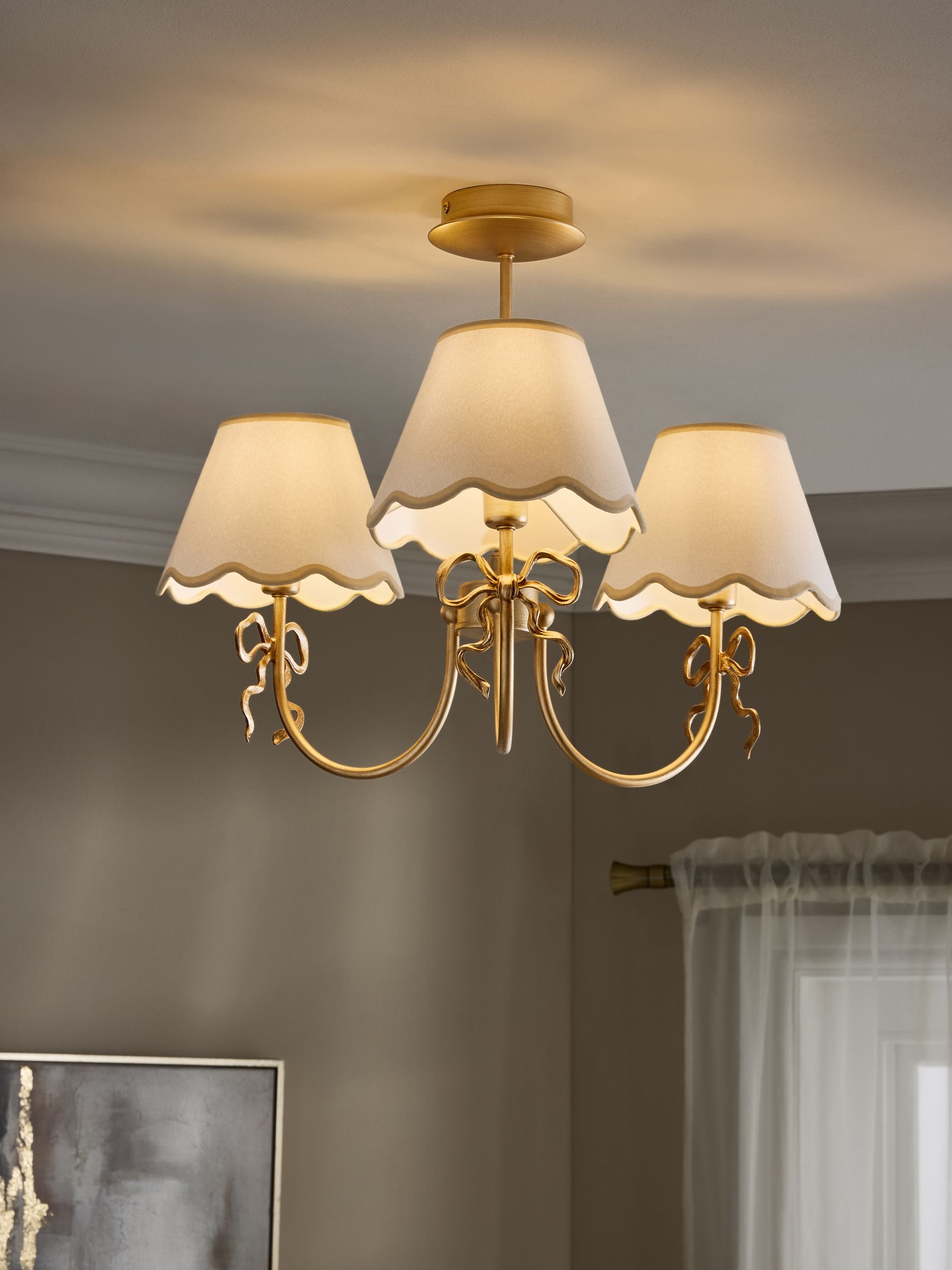 Brass bow chandelier with delicate scalloped shades - British product