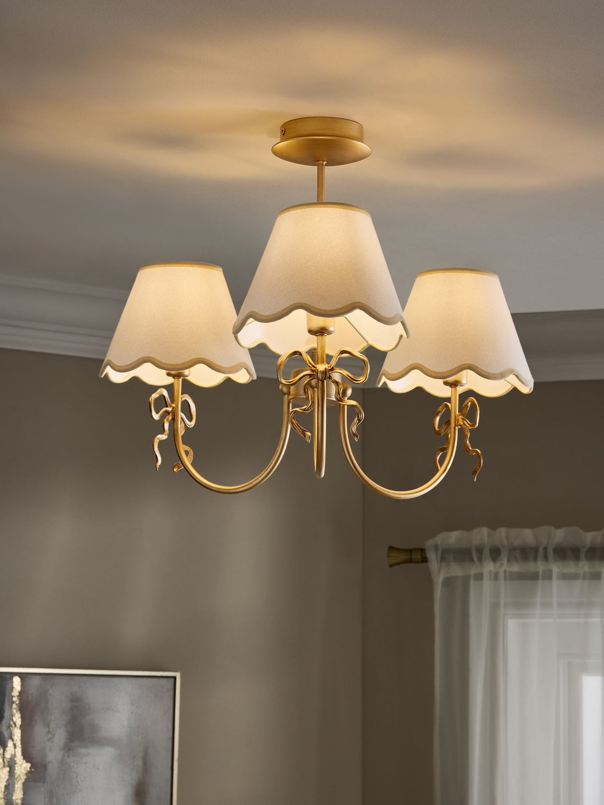 Brass bow chandelier with delicate scalloped shades - British product
