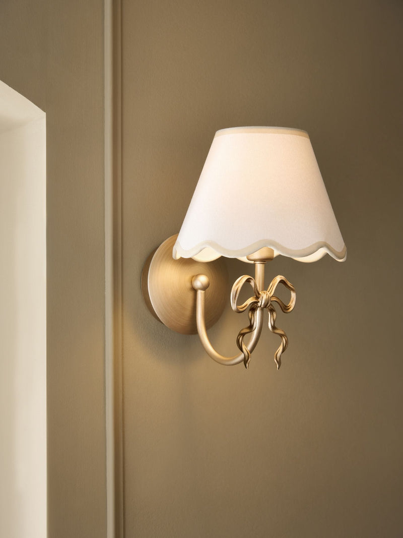 Brass Bow rechargeable wall light with fabric shade, imported from the UK