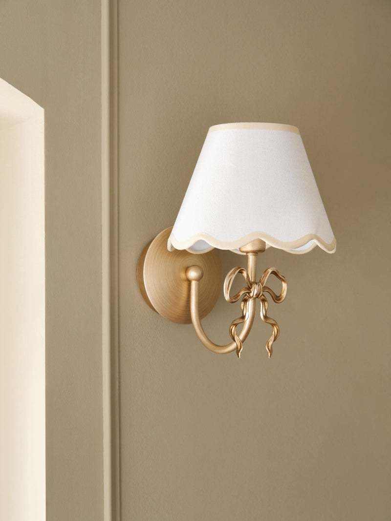 Brass Bow rechargeable wall light with fabric shade, imported from the UK