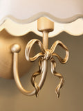 Brass Bow rechargeable wall light with fabric shade, imported from the UK