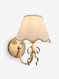 Brass Bow rechargeable wall light with fabric shade, imported from the UK