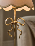 Wireless rechargeable brass bow table lamp (British brand)