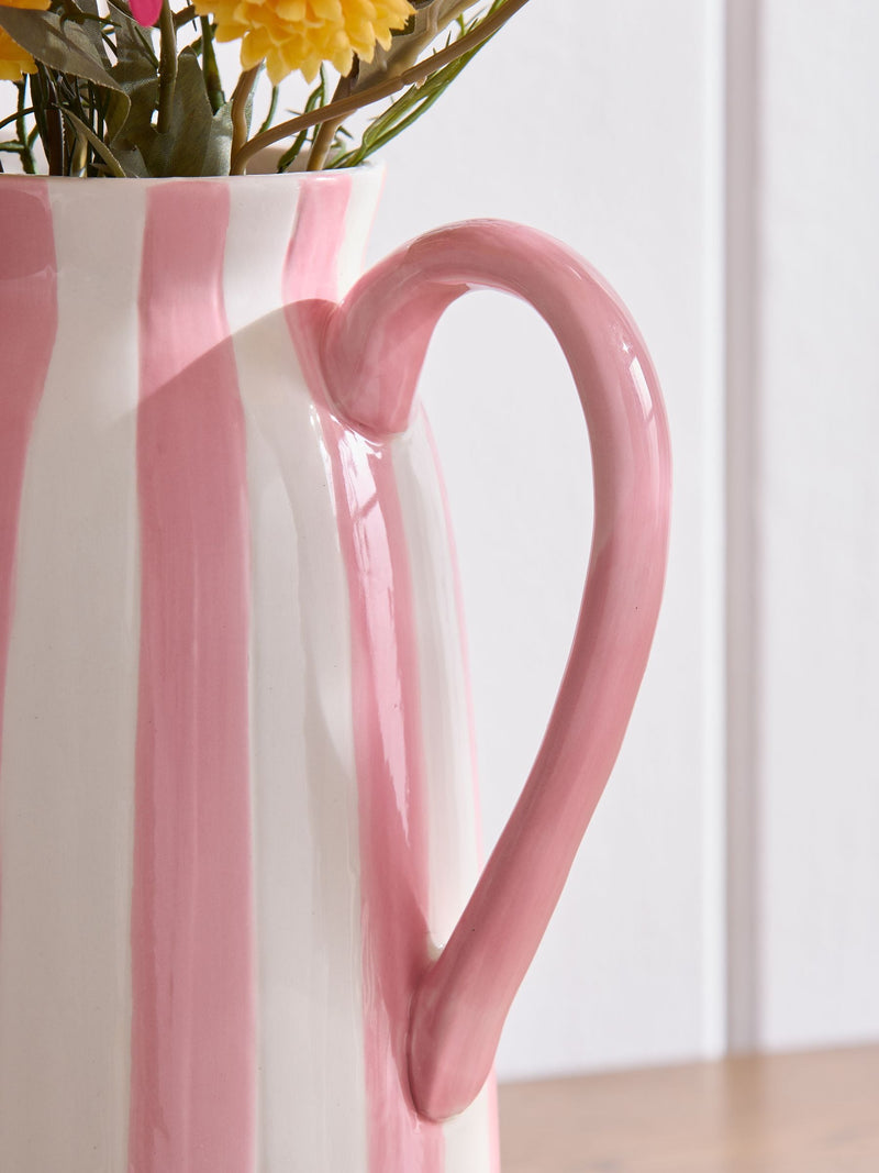 Lucy Tiffney pink artificial dahlia arrangement in striped jug vase, UK version