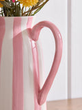 Lucy Tiffney pink artificial dahlia arrangement in striped jug vase, UK version
