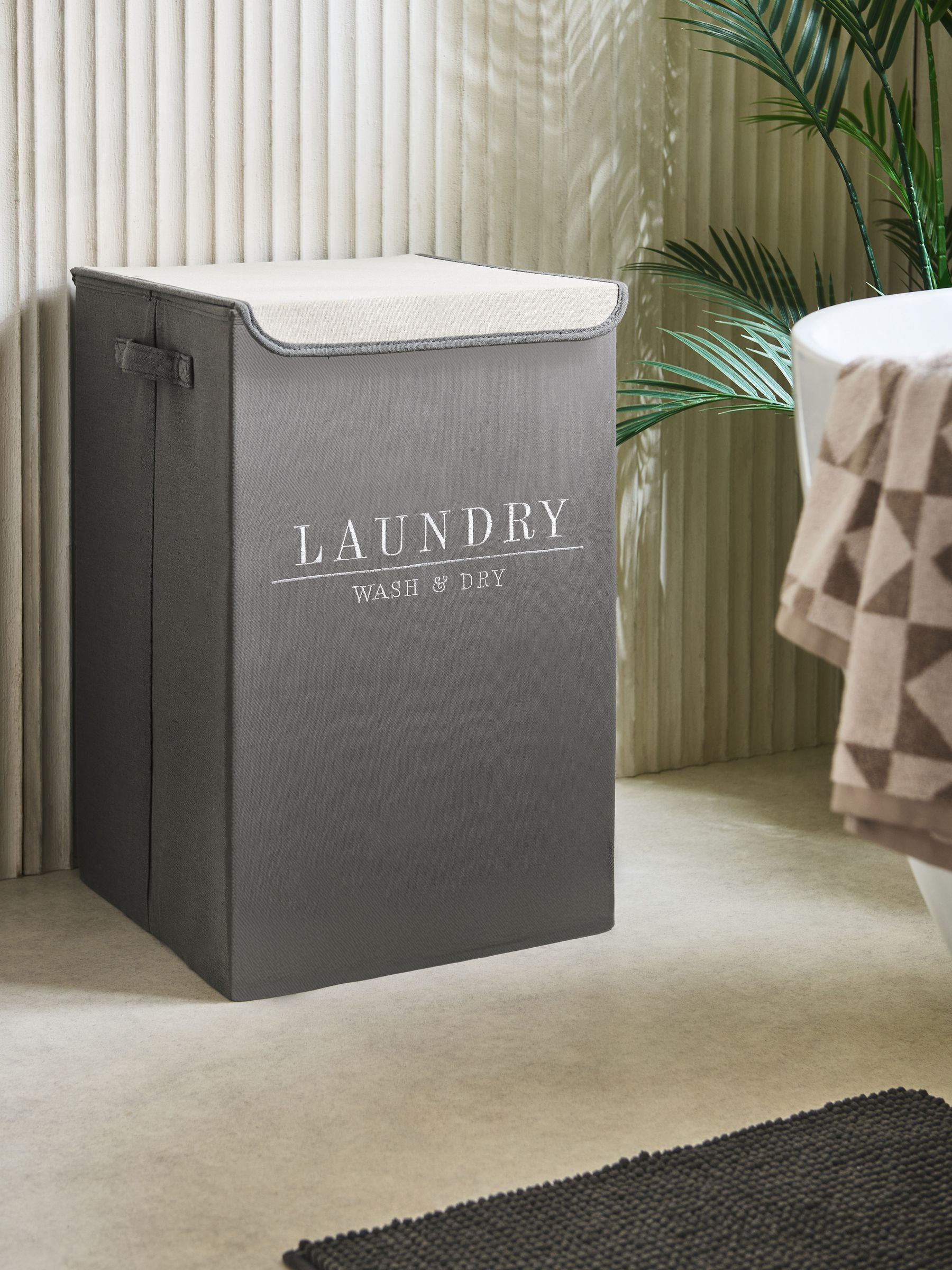 Sage green laundry sorter basket with embroidered detail - British product