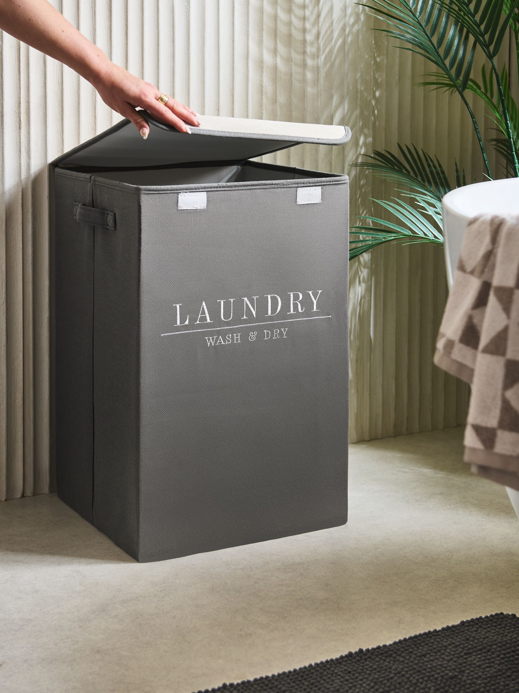 Sage green laundry sorter basket with embroidered detail - British product