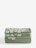 Sage green fleece throw with floral heart motifs, UK version