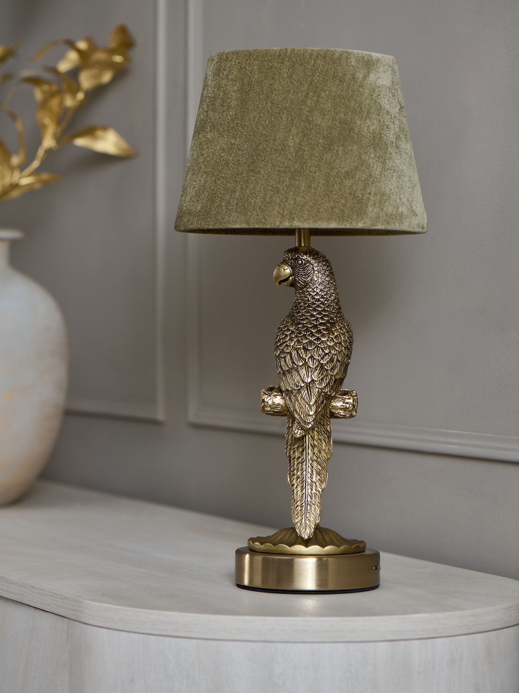 Gold Coco Parrot rechargeable wireless table lamp in brass and olive green, UK version