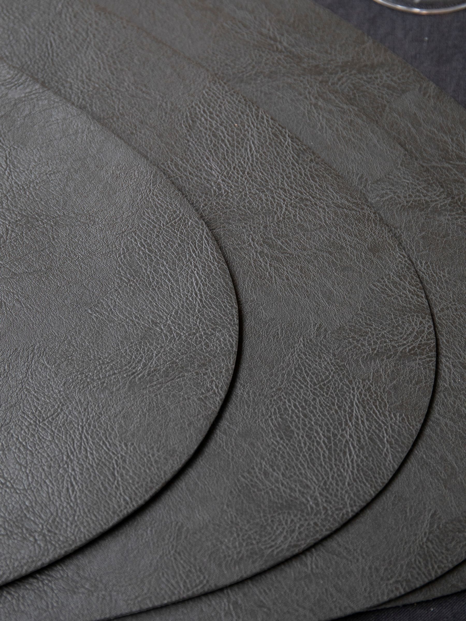 Mikasa black pebble-shaped faux leather placemat set of 4, imported from the UK