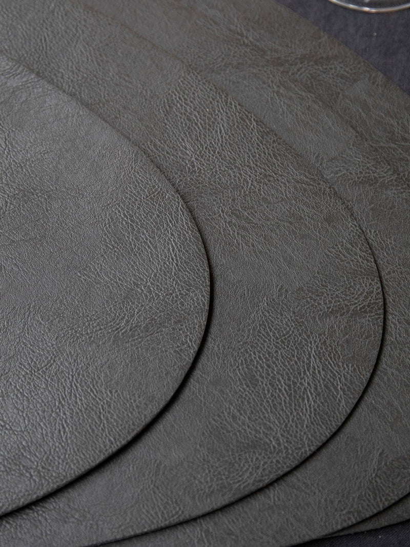 Mikasa black pebble-shaped faux leather placemat set of 4, imported from the UK