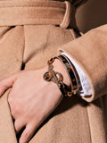 Lauren Ralph Lauren gold tone crest bangle bracelet, UK version