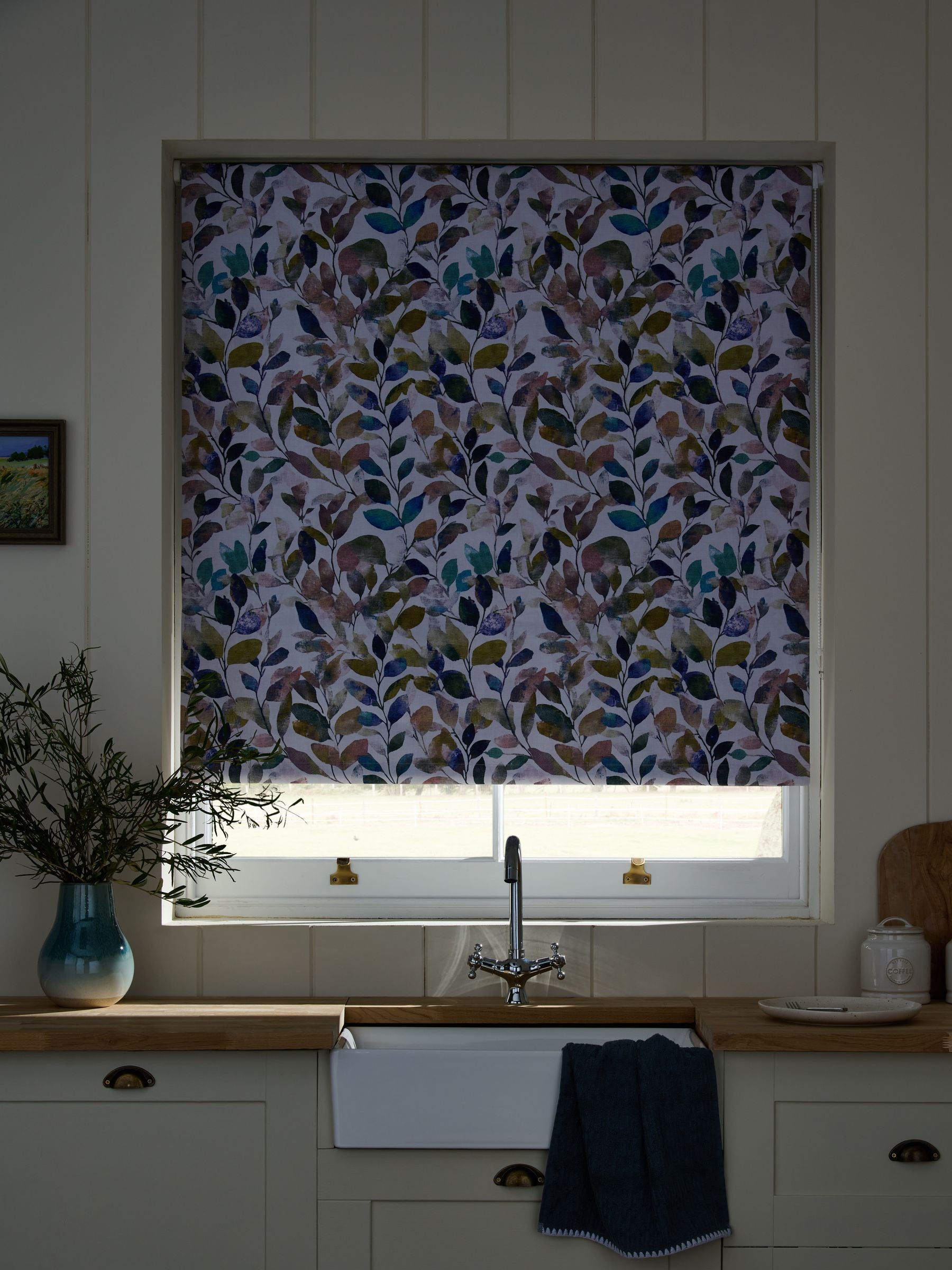 Multicoloured leaf print blackout roller blind, imported from the UK