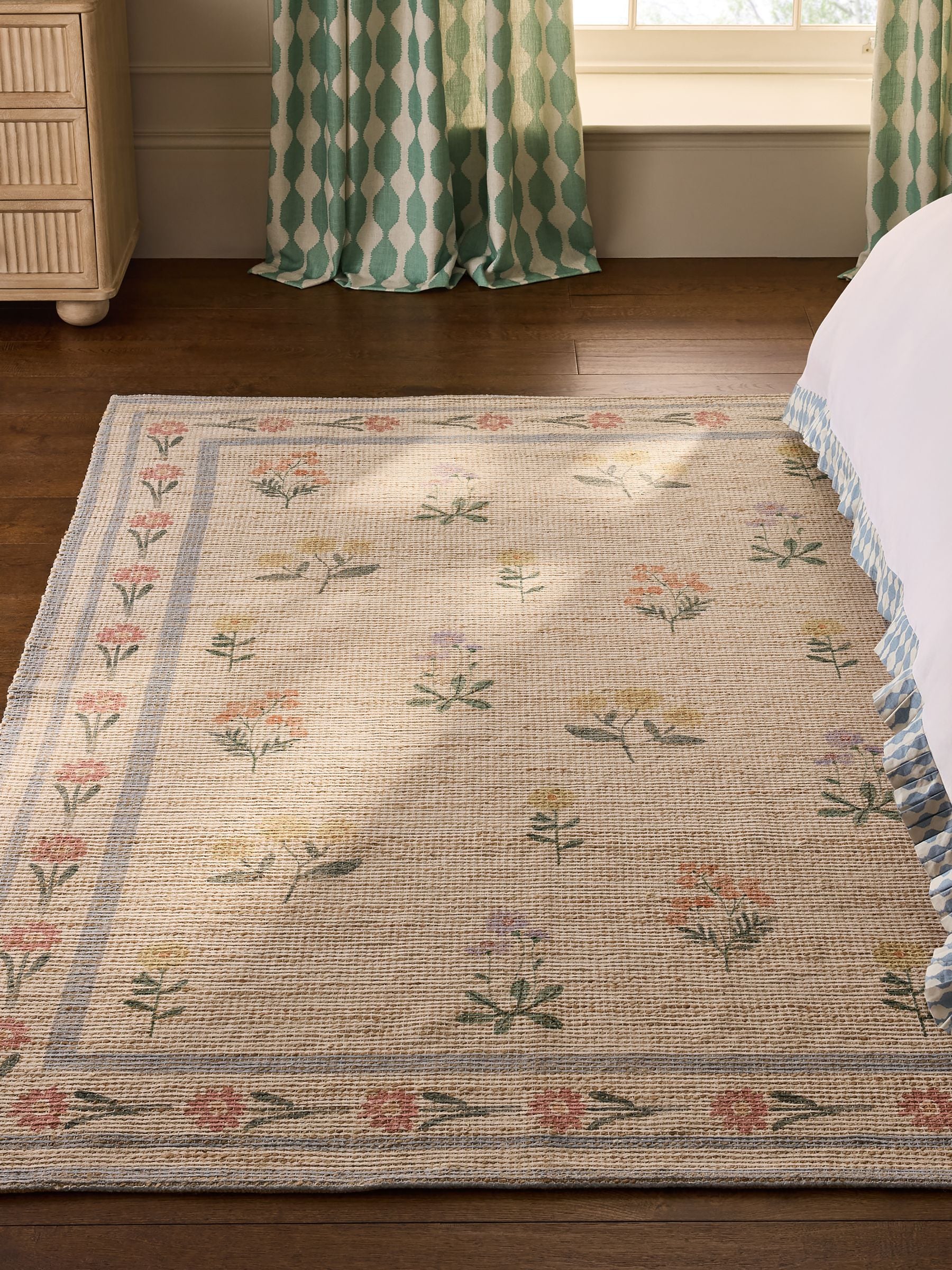 Natural jute rug with floral border, imported from the UK