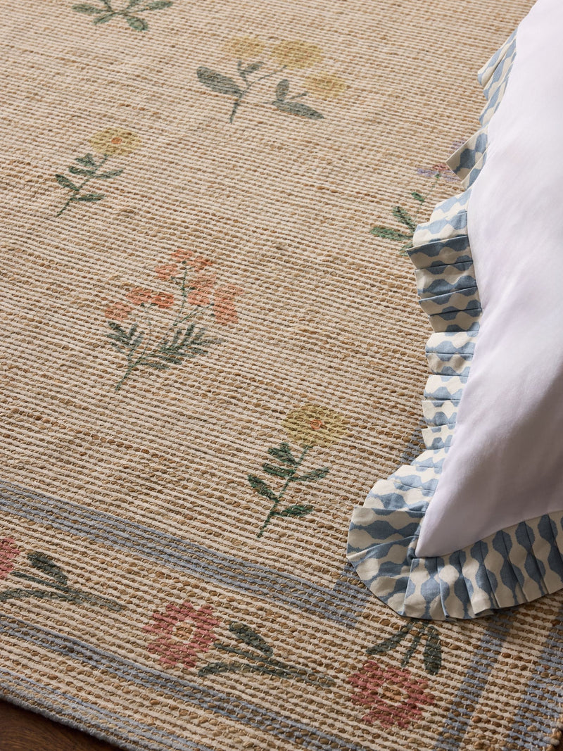 Natural jute rug with floral border, imported from the UK
