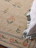 Natural jute rug with floral border, imported from the UK