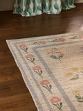 Natural jute rug with floral border, imported from the UK