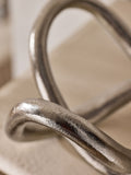 Lipsy silver knot ornament made from aluminium (British brand)