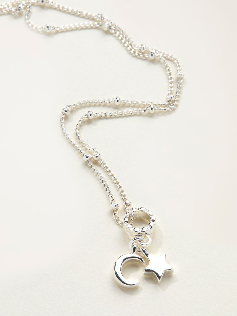 FatFace silver tone star and moon necklace, imported from the UK