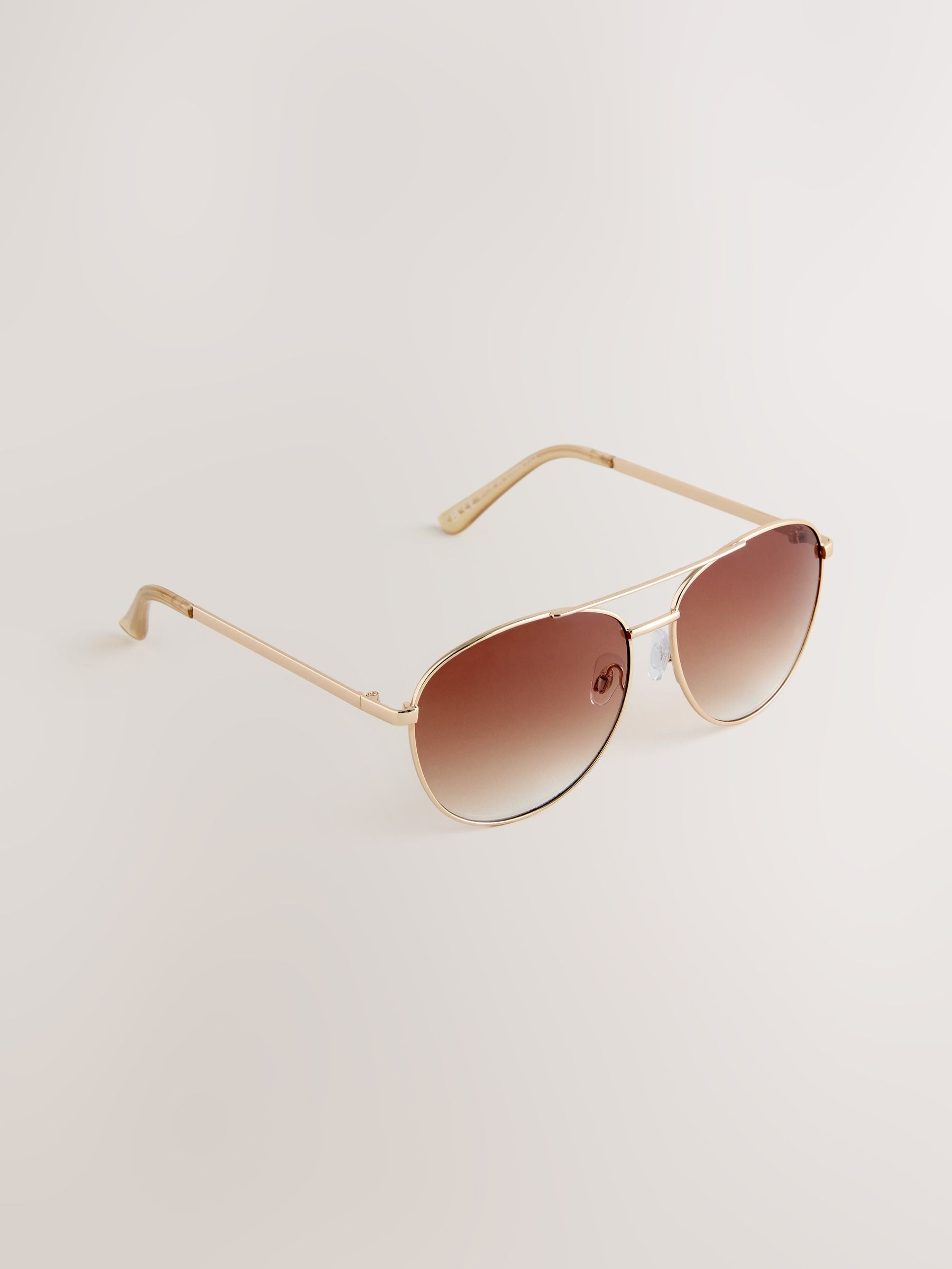 Gold metal aviator style sunglasses, imported from the UK