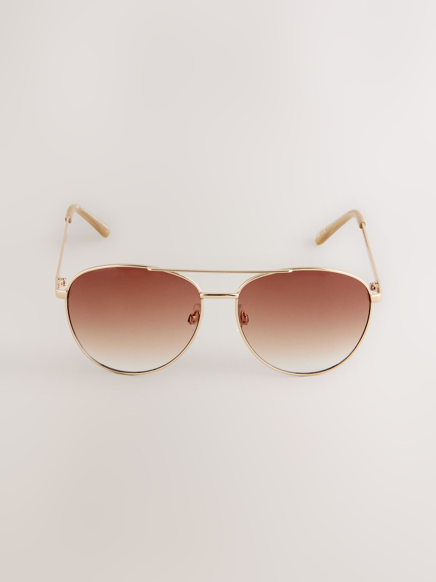 Gold metal aviator style sunglasses, imported from the UK