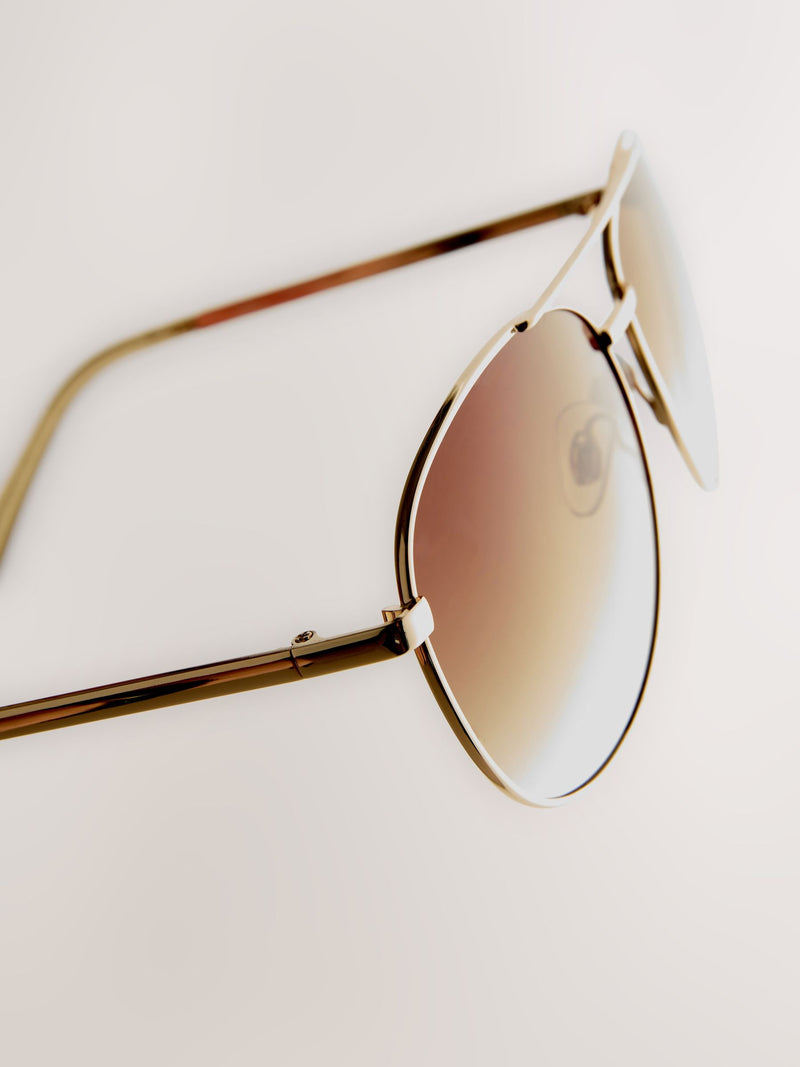 Gold metal aviator style sunglasses, imported from the UK