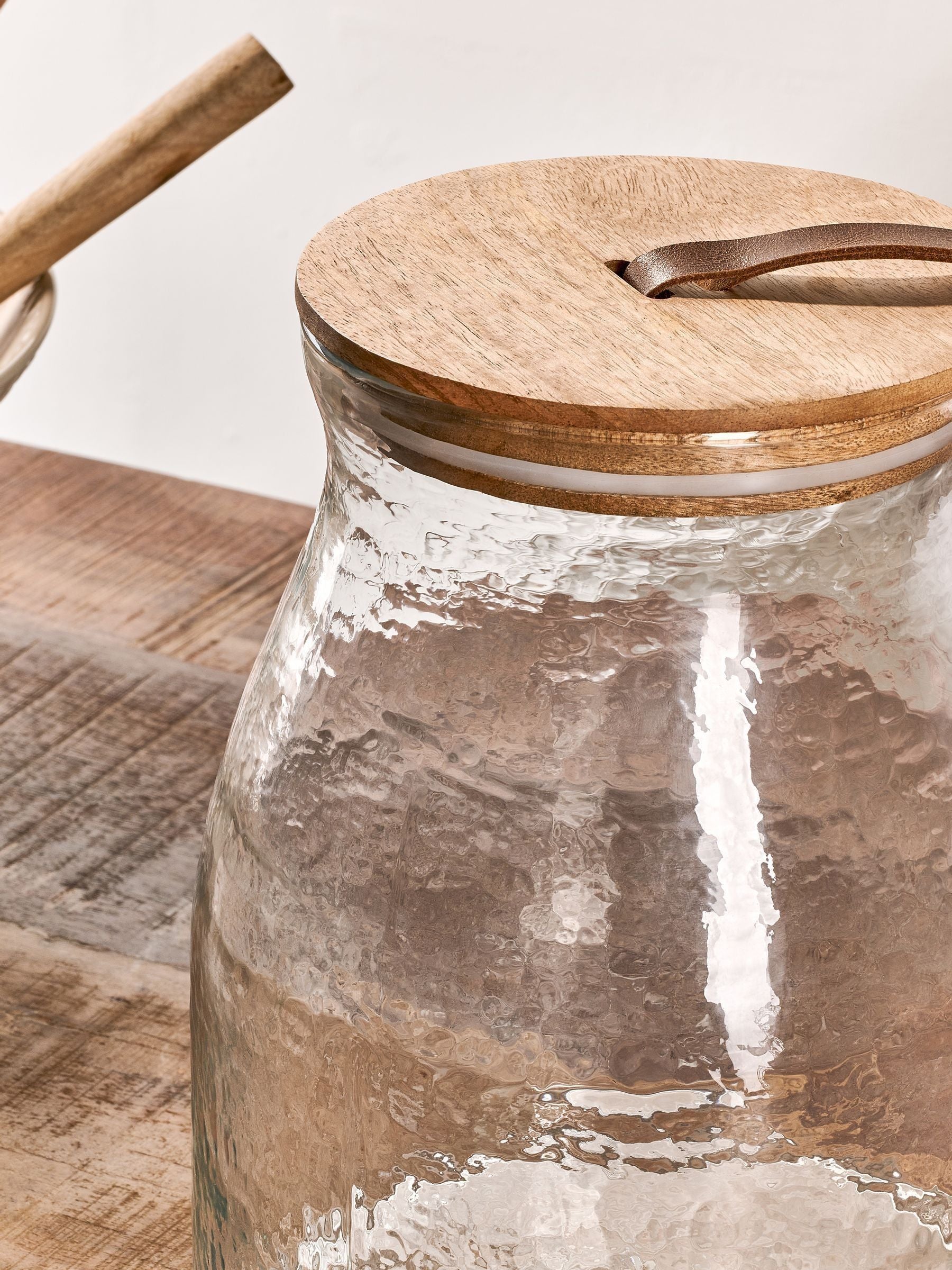 Nkuku Clear Shaan glass storage jar with wood lid, 25.5cm height, imported from the UK