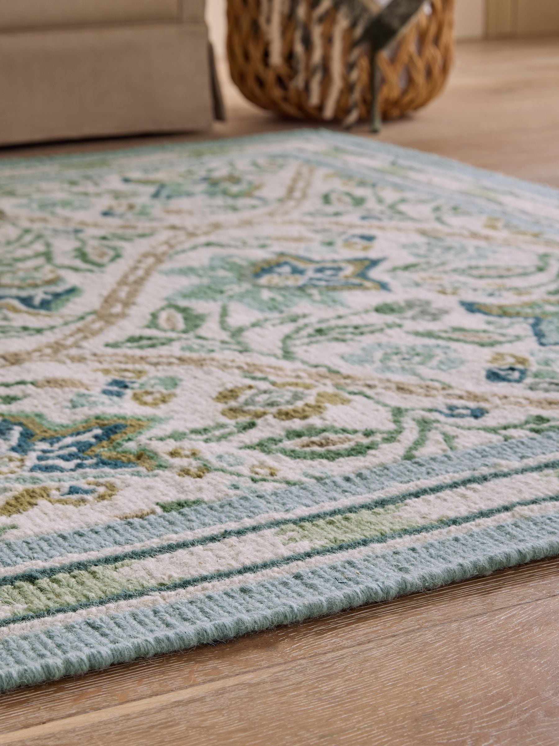 Nina Campbell green floral hand knotted rug, imported from the UK