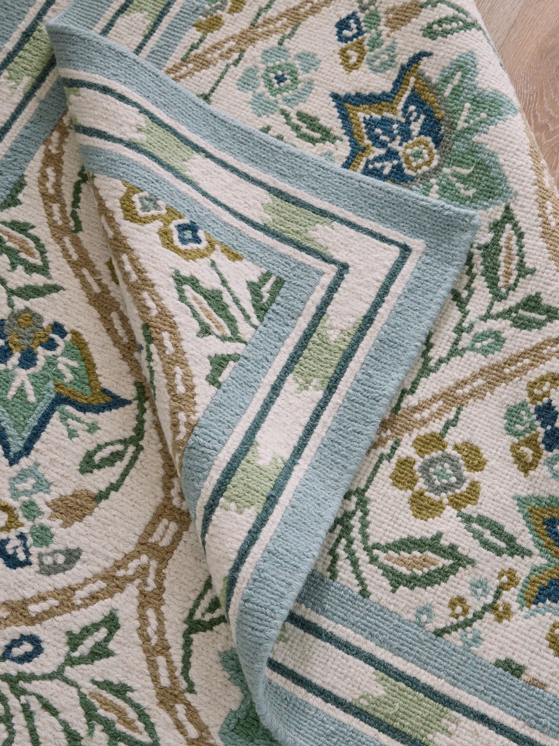 Nina Campbell green floral hand knotted rug, imported from the UK