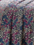 Dreams & Drapes Bessie navy quilted bedspread with floral print, UK version
