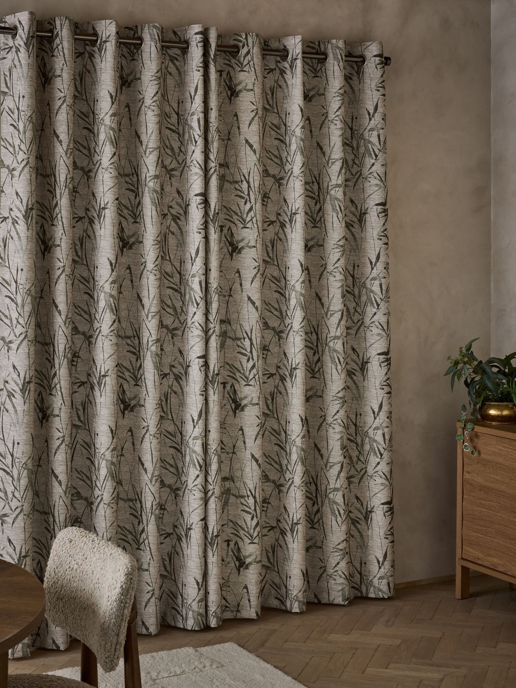 Curtains with blurred leaf print eyelet in olive green (British brand)