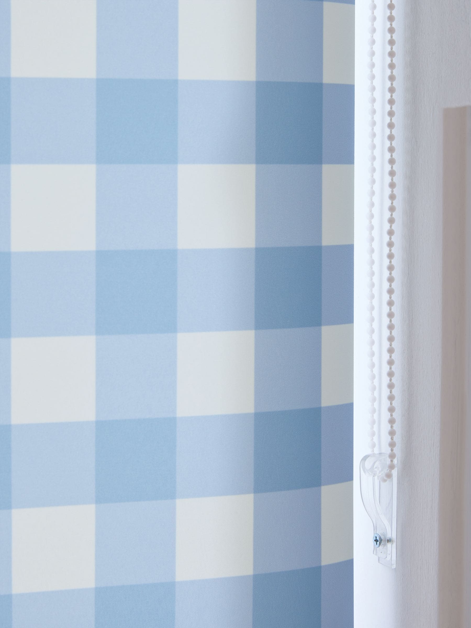 Blue gingham check roller blind (British brand)