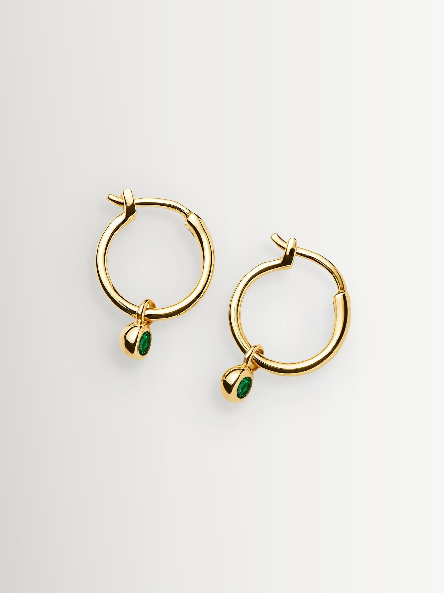Missoma gold tone tennis charm mini hoop earrings, imported from the UK