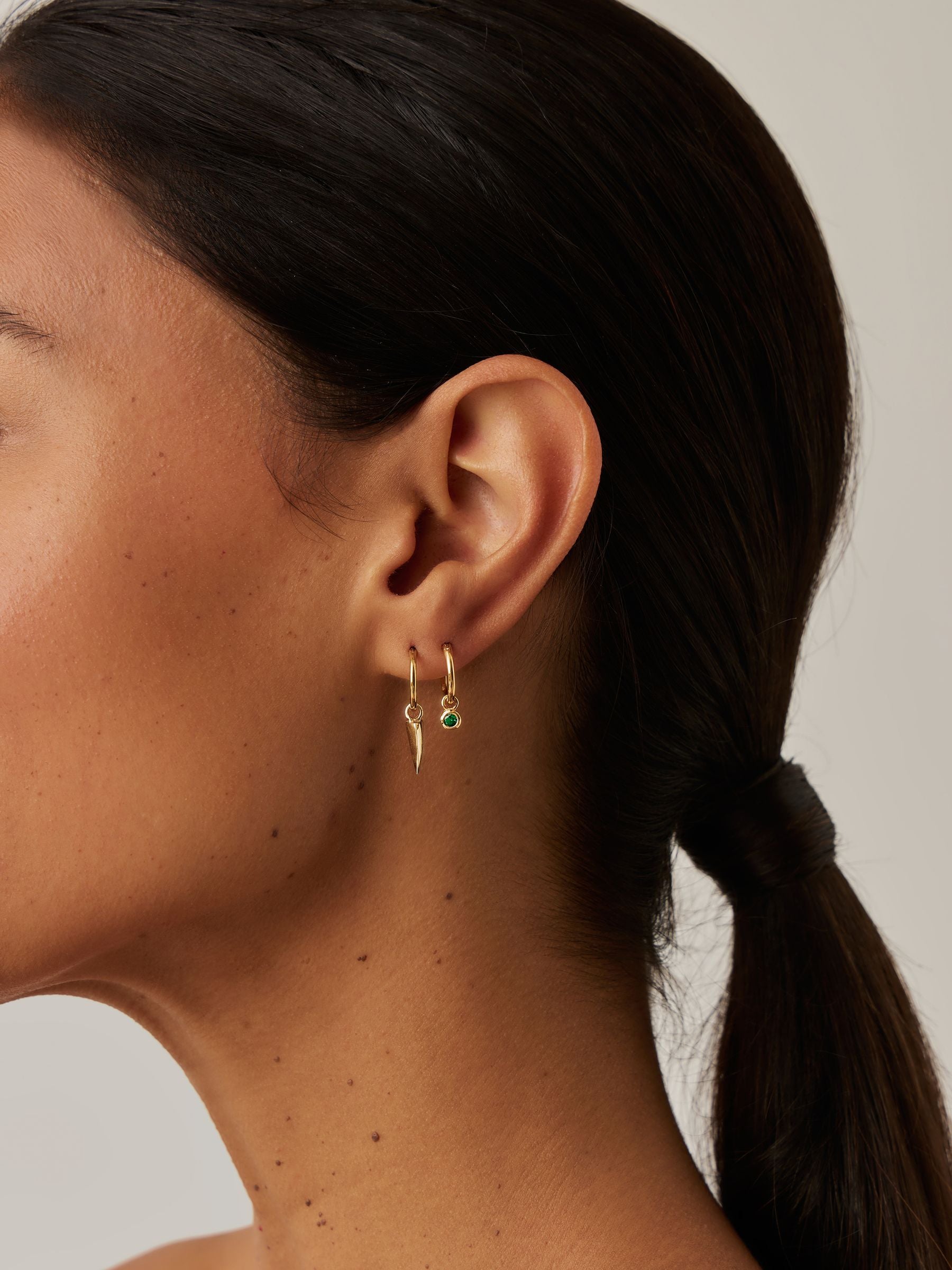 Missoma gold tone tennis charm mini hoop earrings, imported from the UK