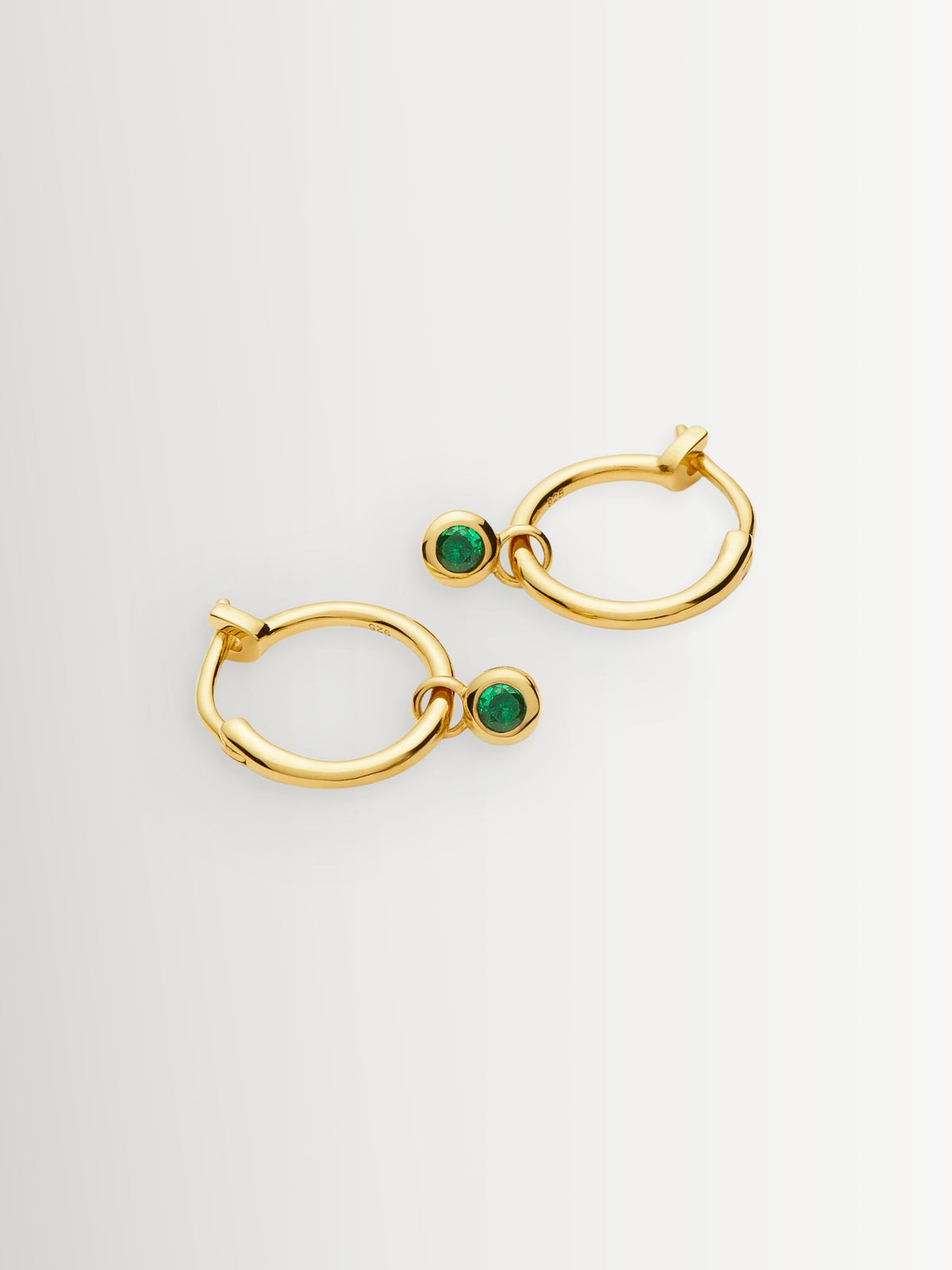 Missoma gold tone tennis charm mini hoop earrings, imported from the UK