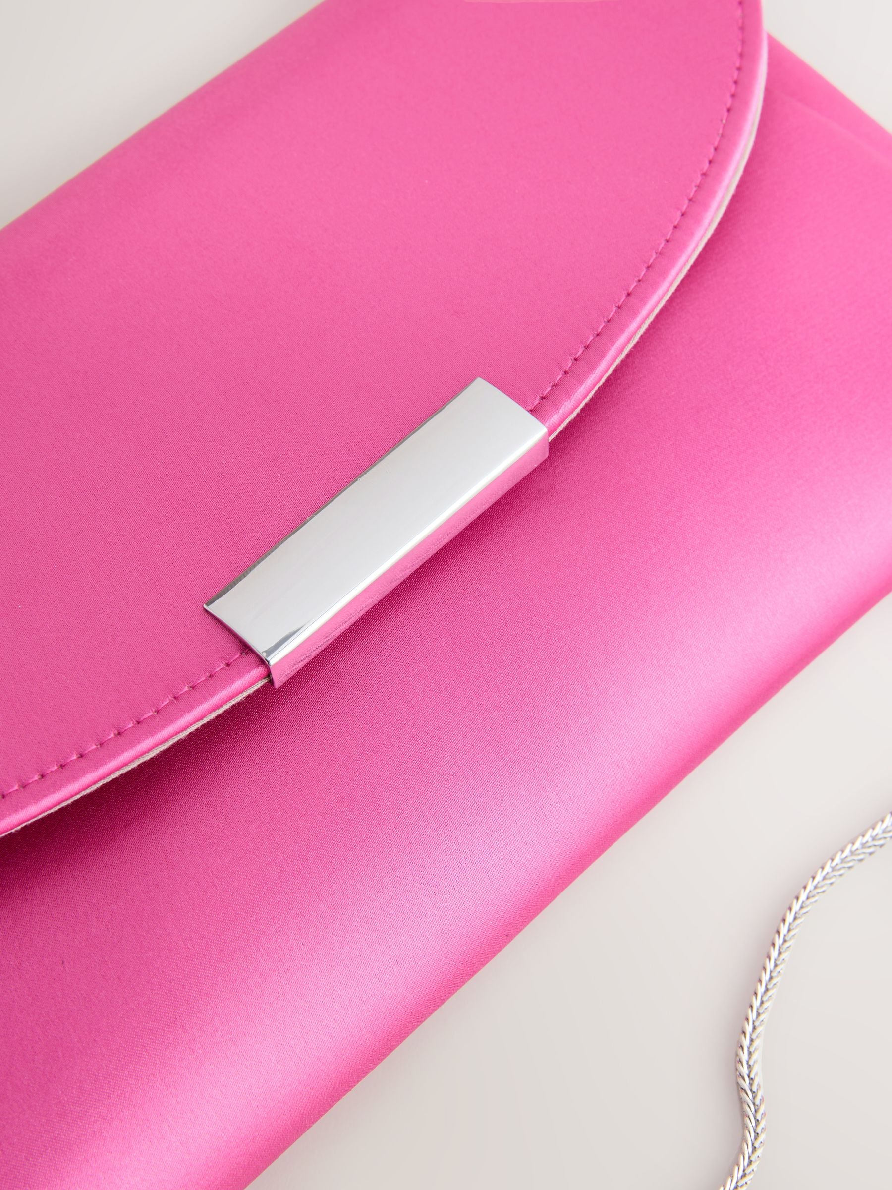 Pink clutch bag with chain strap (British brand)