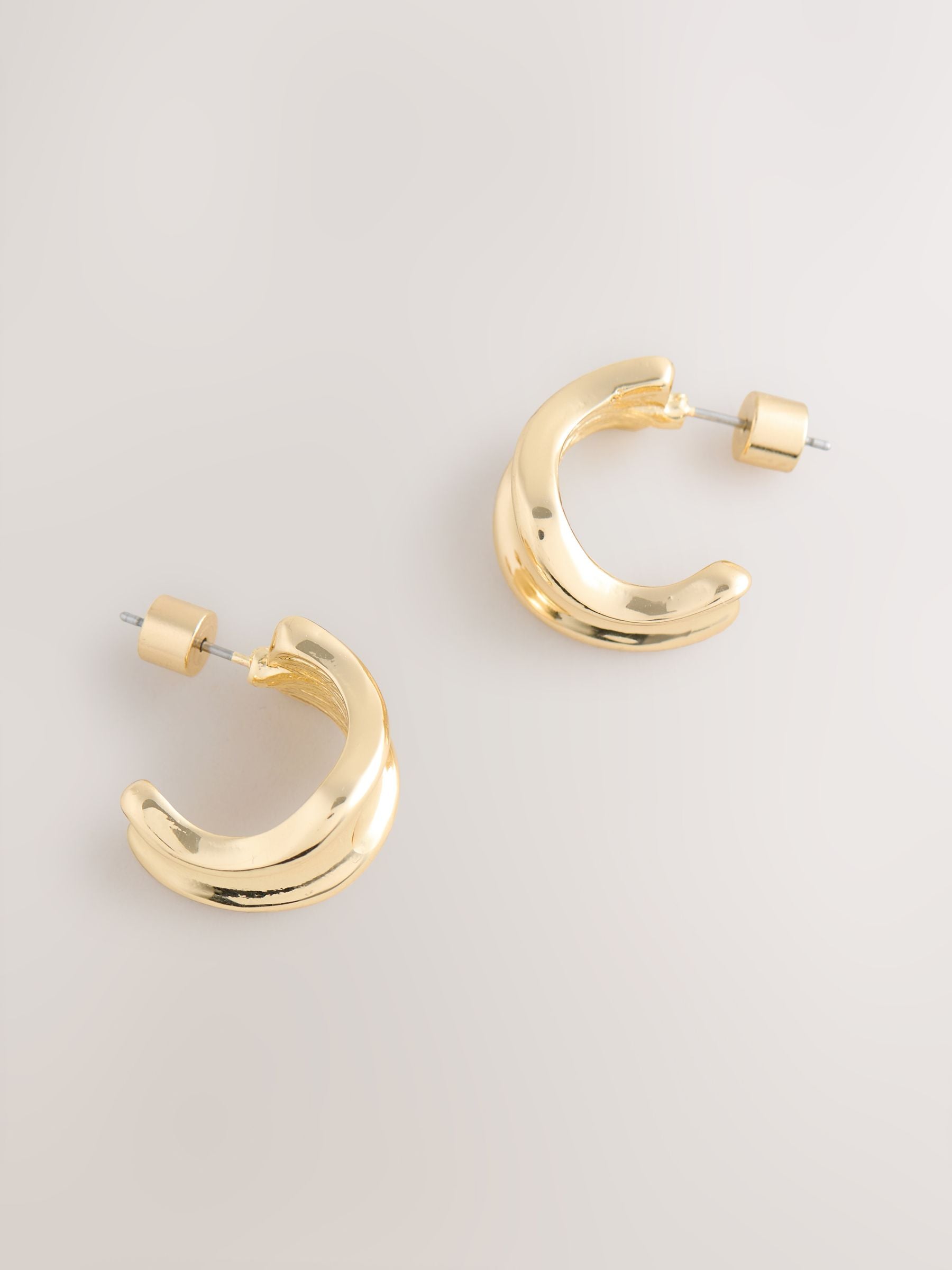 Gold tone wide hoop earrings, UK version