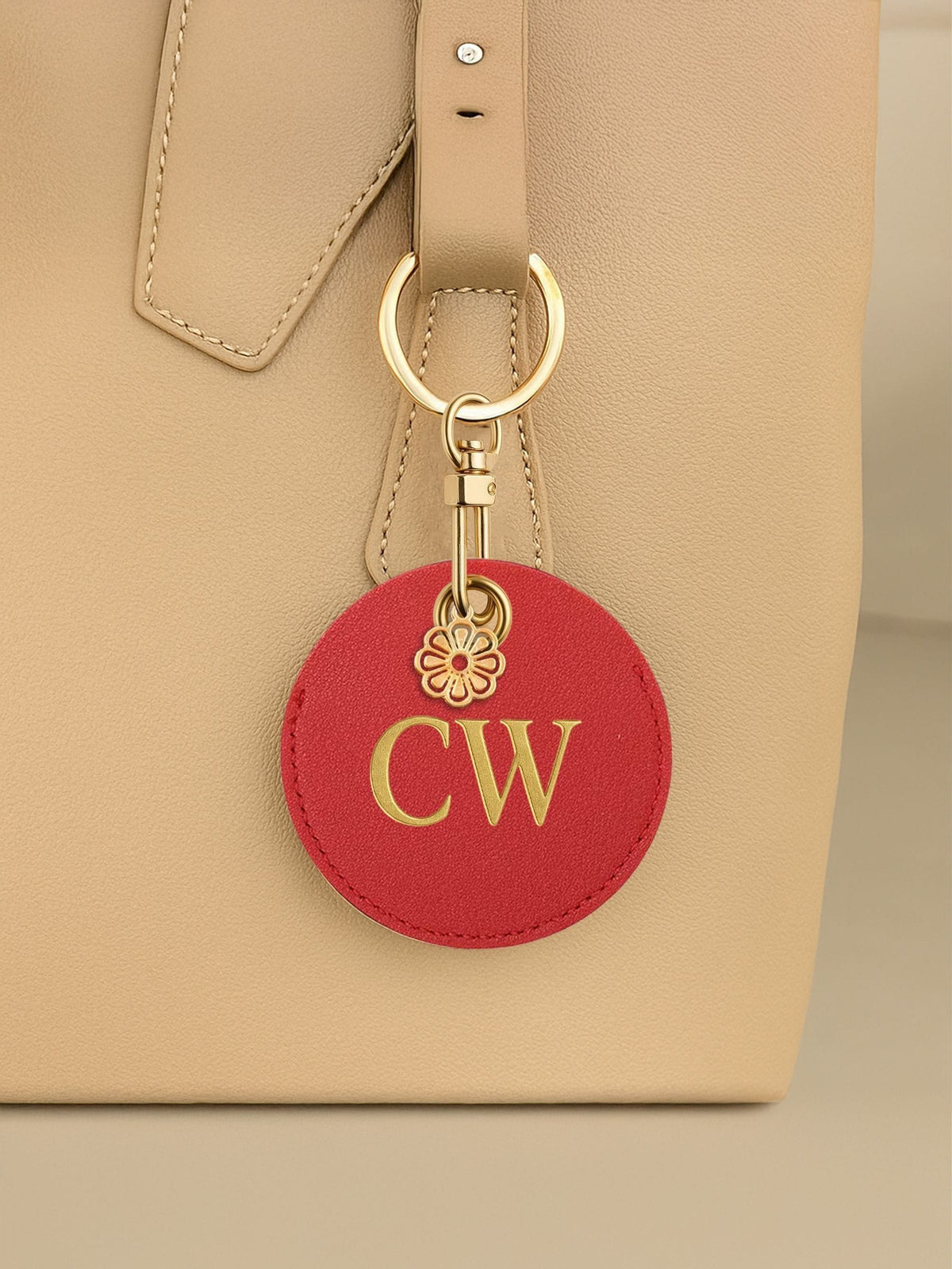 Jonnys Sister faux leather bag charm with gold tone flower, imported from the UK