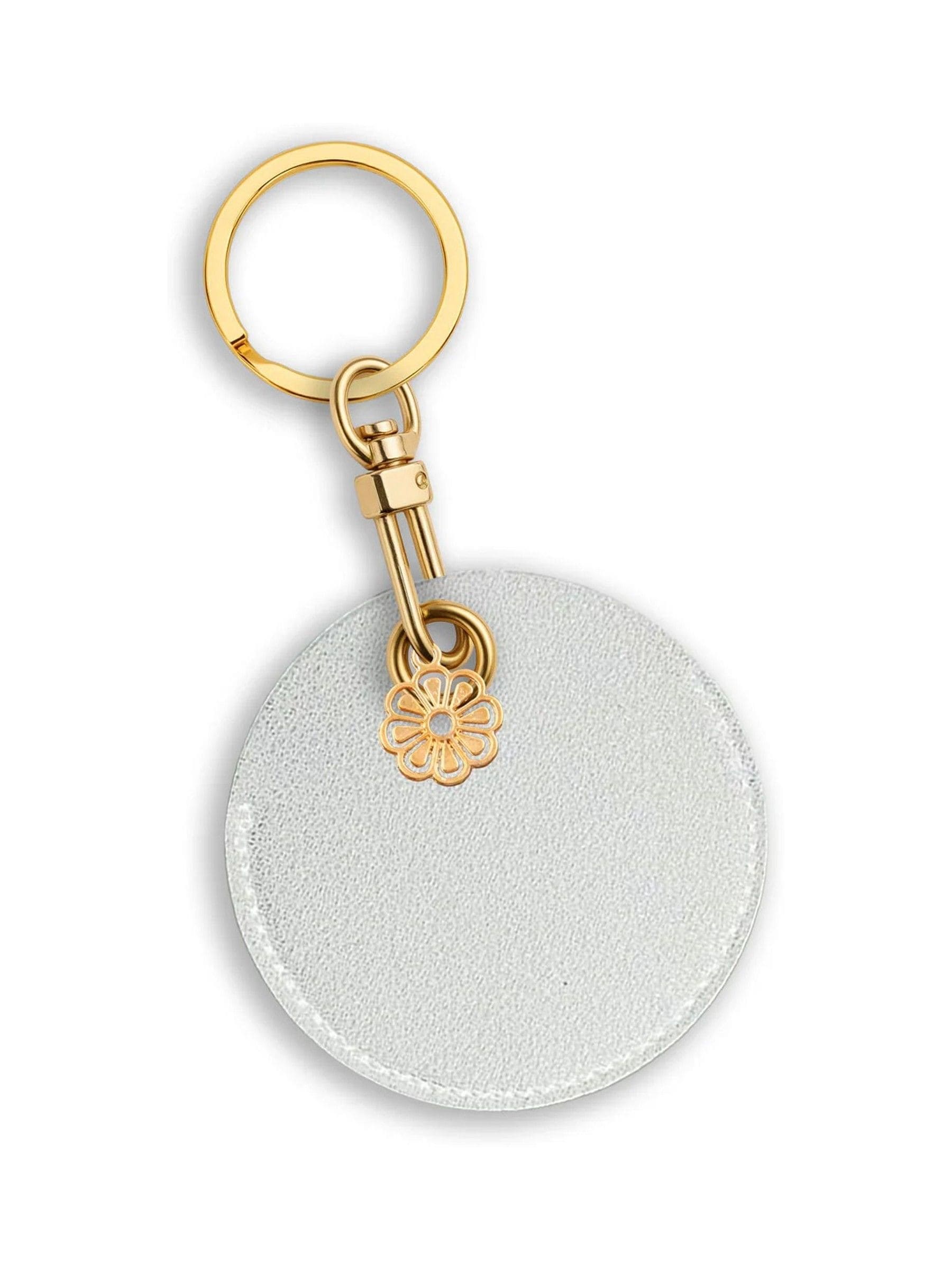 Jonnys Sister faux leather bag charm with gold tone flower, imported from the UK